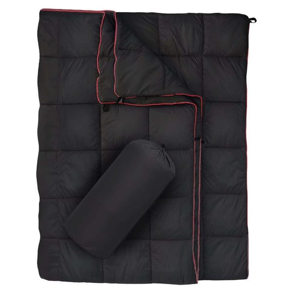 Black wearable camping blanket with storage bag, product view